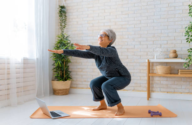 istock Senior woman exercising at home. 1286144672