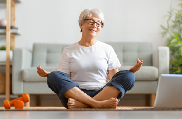 istock senior woman doing yoga 1286144697