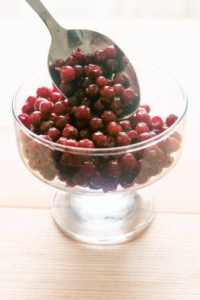 istock Frozen berries are placed in a glass dish with a spoon 1286144797