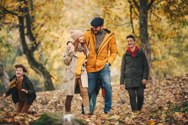 istock Family enjoys Autumn in forest. 1286144906