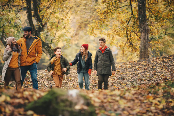 istock Parents with their children walk in nature. 1286144954