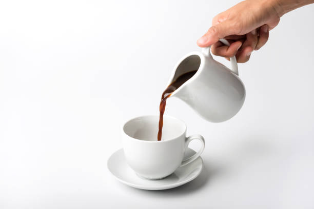 istock cup of coffee over white background. breakfast 1286145684