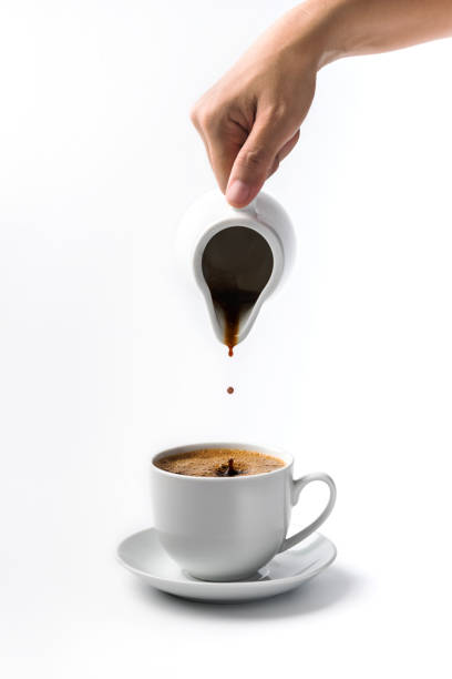 istock pouring a cup of coffee over white background 1286145742
