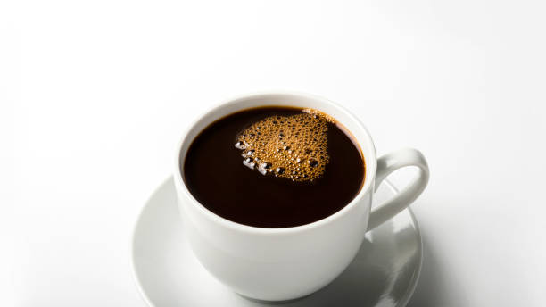 istock black coffee in a coffee cup top view isolated on white background. breakfast 1286145748