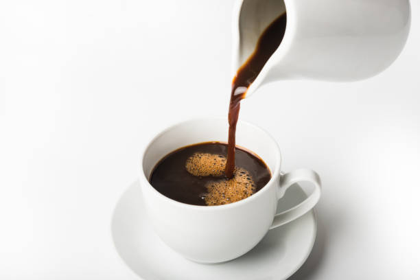 istock pouring a cup of coffee over white background 1286145759