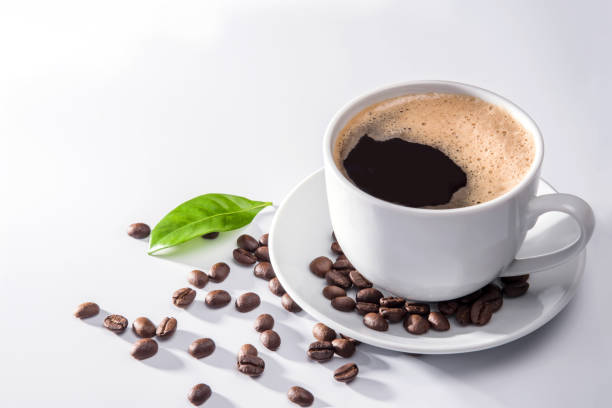 istock Coffee cup and coffee beans on white background 1286145842