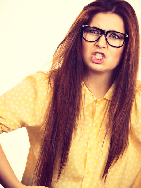 istock Angry young woman with eyeglasses 1286147814