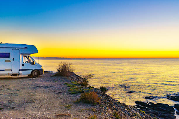 istock Rv camper camping on sea shore, Spain. 1286148495