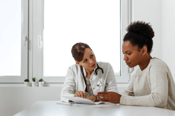 istock Middle-aged woman at clinic, problems with health. 1286148649