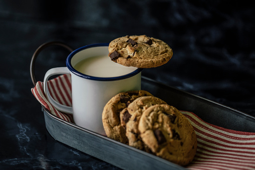 White cup of coffee and chocolate cookie