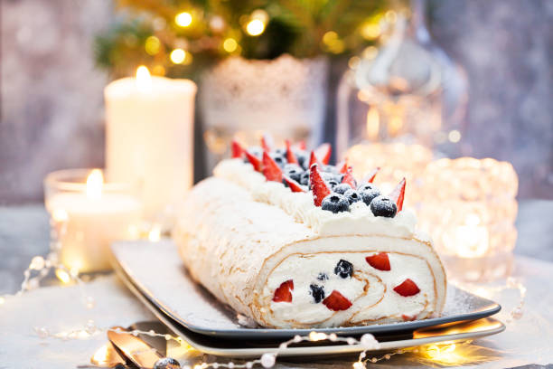 istock Meringue roll cake with cream and fresh berries 1286150018