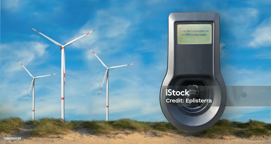 Renewable energy banner. with electric car charging station. Wind generator in nature background, landscape format for banner advertising. Green energy and electricity concept for electric car Renewable energy banner. with electric car charging station. Wind generator in nature background, landscape format for banner advertising. Green energy and electricity concept for electric car. Renewable Energy Stock Photo