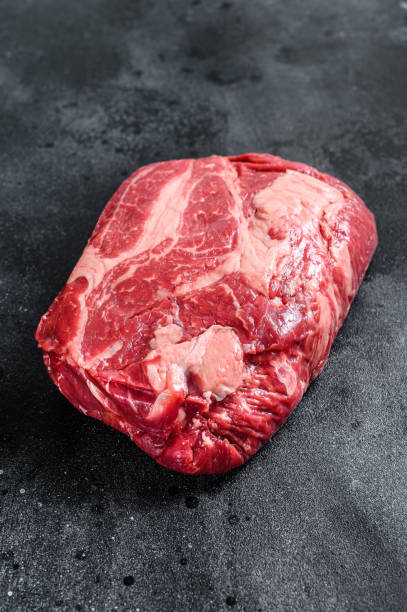 istock Raw Chuck eye roll steak. Organic beef. Black background. Top view 1286150545