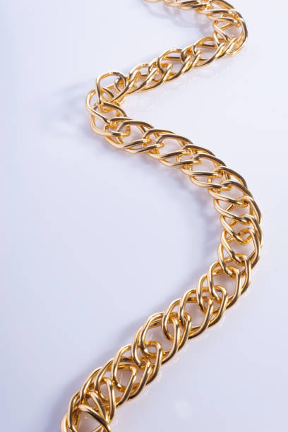 istock thick gold chain on a white background, top view 1286153318