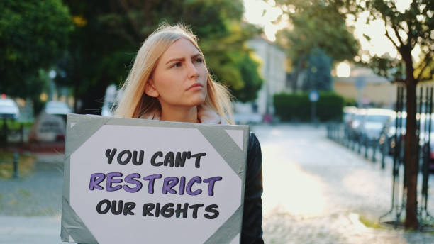 istock Blonde woman protesting against human rights restriction 1286156001