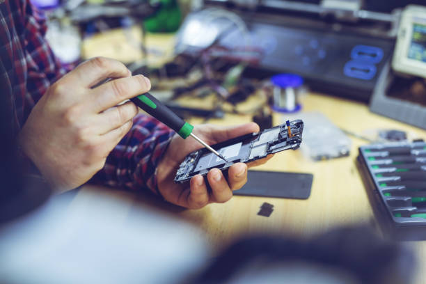 istock Young man repairing a technology device 1286156510