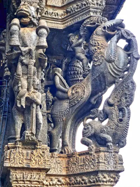 Ancient stone carvings of Horse sculpture with a warrior carved prominently in the corridor pillars of the historical temple in Tamilnadu.