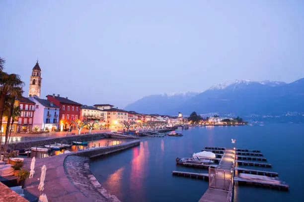 Ascona City in Dusk with Mountain and Alpine Lake Maggiore in Ticino, Switzerland.