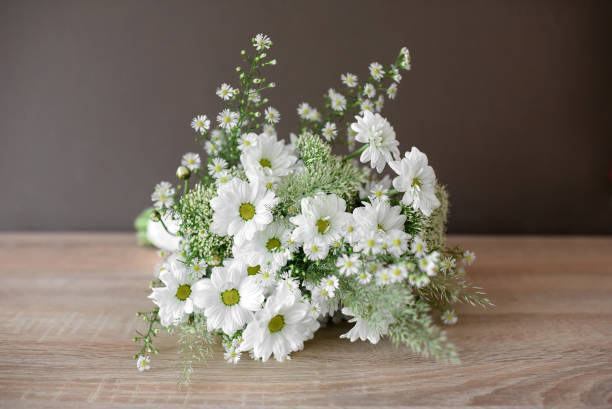 Dainty bridal bouquet with fresh white daisies