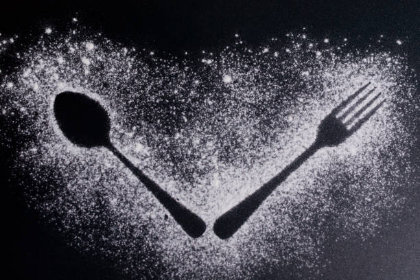 istock Images of fork and spoon on a white flour background. 1286161726