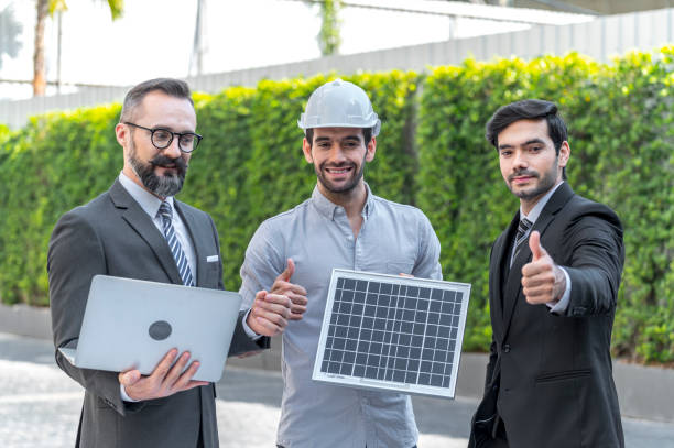 istock Two Businessman and power engineering talking and checking quality power solar cell with laptop computor on site new project power solution business 1286166261