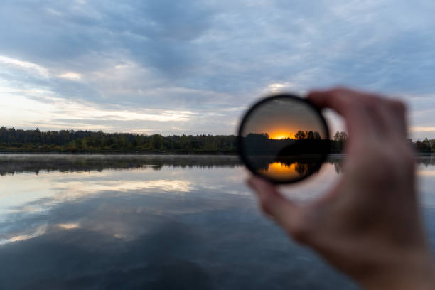 istock Sunset on the lake through darkened glass 1286170686