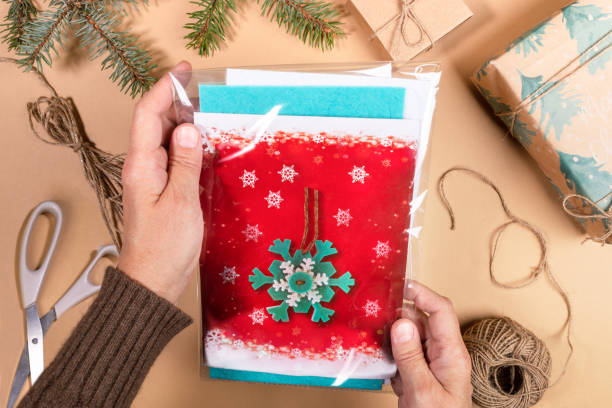 istock Step by step instruction of making DIY Christmas toy snowflake. Step 1 - Take packaging. 1286174342