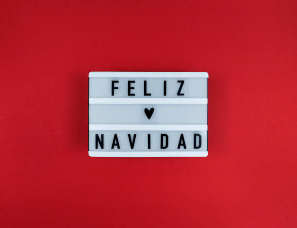 燈箱與費利茲納維達短語，西班牙聖誕快樂在紅色背景。 - navidad 個照片及圖片檔