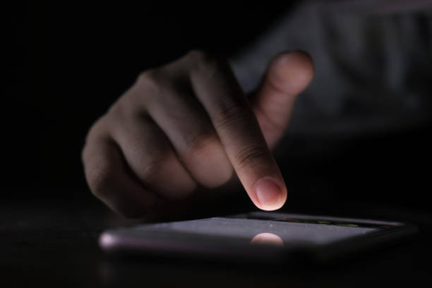 istock Close up of women's hand using smart phone at night 1286175422