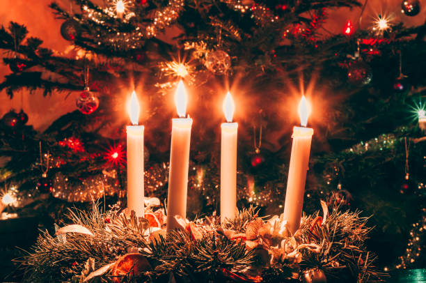 istock four burning advent candles background 1286182350
