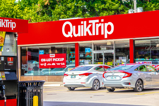 07_14_2020 Tulsa USA Quick Trip store - very popular convenience store and employer in Tulsa OK with gas pump and pretty cars parked in front