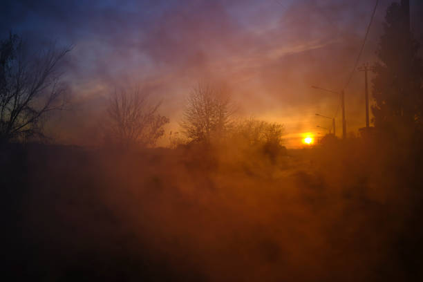 istock Street at sunset with smoke 1286184208