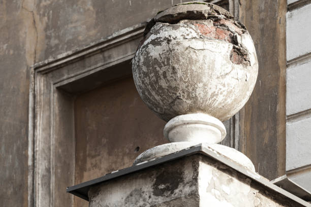 Old house facade decoration sphere. Abandoned building architecture, St.Petersburg