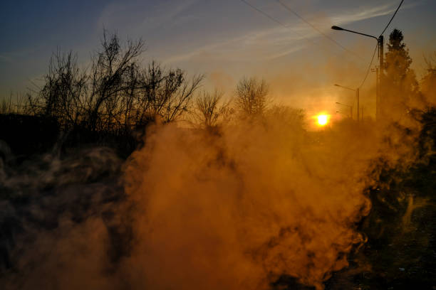 Street at sunset with smoke