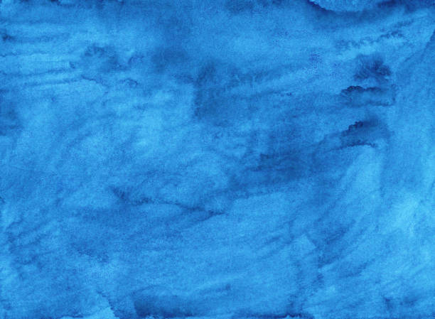 istock Watercolor liquid blue background texture. Hand painted watercolour backdrop. Sky blue stains on paper. 1286186410