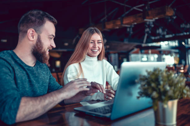 istock Male Helping His Girlfriend With Freelance Work On Laptop 1286188132