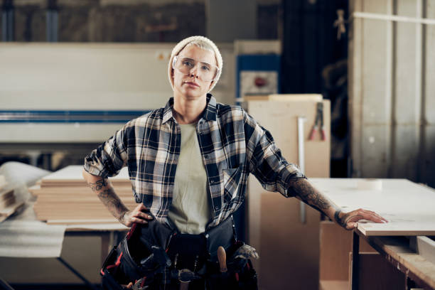 istock Strong woman working as carpenter 1286188782