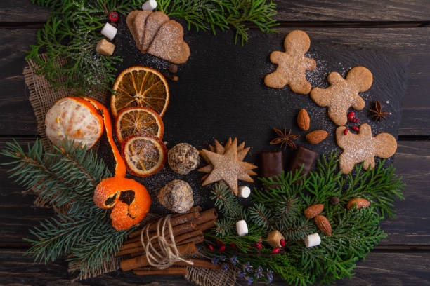istock Christmas and New Year compositions on a black background, cones, spruce, gingerbread. Copy space, flat lay, top point 1286189040