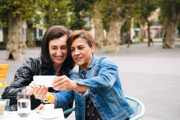 istock Middle aged lesbian couple taking a selfie 1286189303
