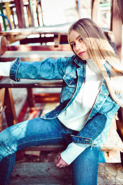istock Beautiful Female Sitting On Bench And Table Outside 1286189463