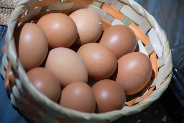 istock closeup of basket with chicken eggs. rustic table in the background 1286190553