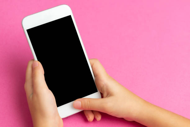 istock Little Girl Using Mobile Phone 1286192286