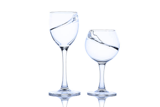 istock Splash of liquid in glasses isolated 1286192386