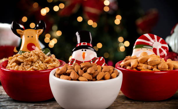Almonds, walnuts and cashew nuts  in a Pot on a christmas background