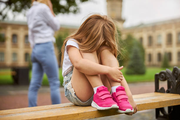 istock Little female child spending time the bench 1286193965