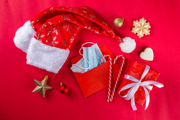 istock Festive Xmas background with face mask and decorations 1286195803
