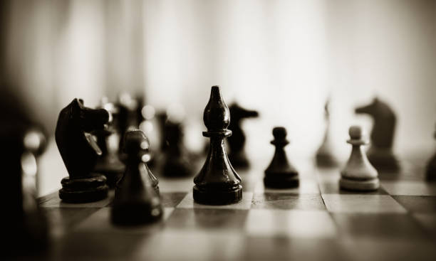 istock Wooden chess pieces on the chessboard. Intellectual game -chess. 1286196341