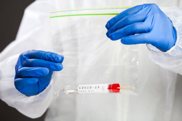 istock COVID-19 virus disease self swab test sample kit 1286196691