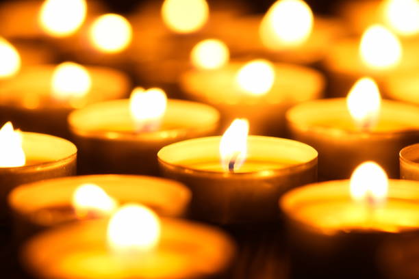istock Many burning candles with shallow depth of field 1286196945