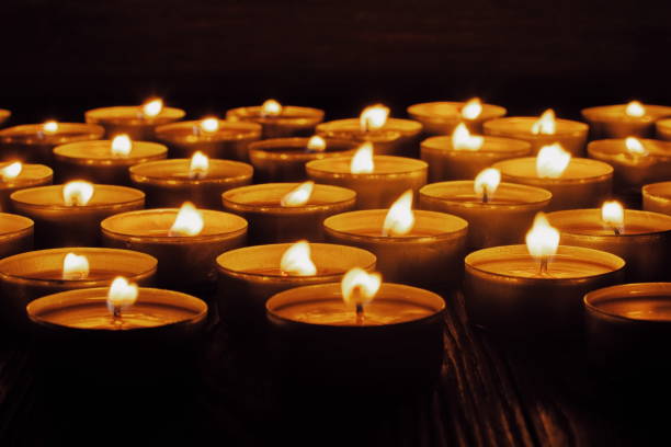 istock Many burning candles with shallow depth of field 1286196975